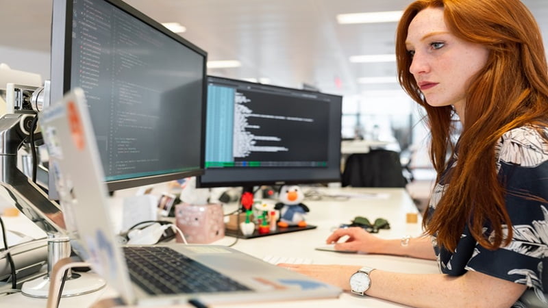 A woman in an office researching email capture on her computer